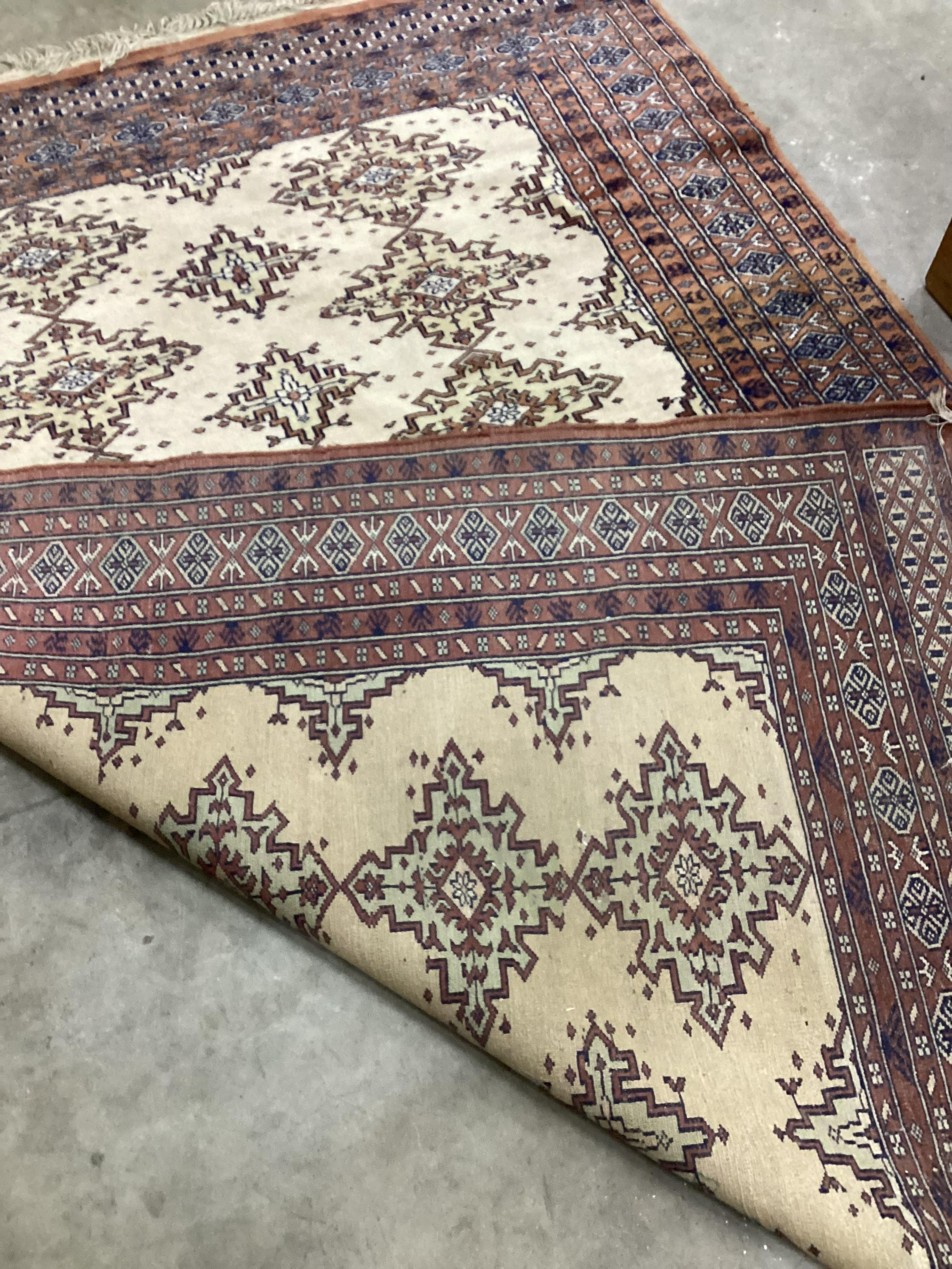 A Bokhara ivory ground rug, 200 x 142cm